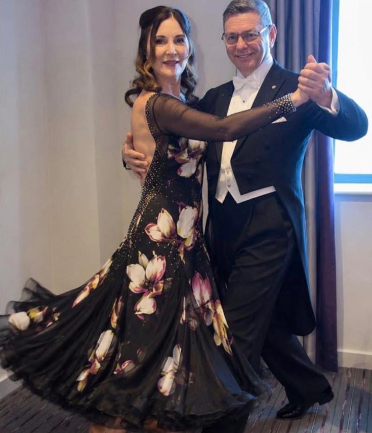 Jo and Paul, the owners of Tudor Dry Cleaners, dressed for ballroom dancing