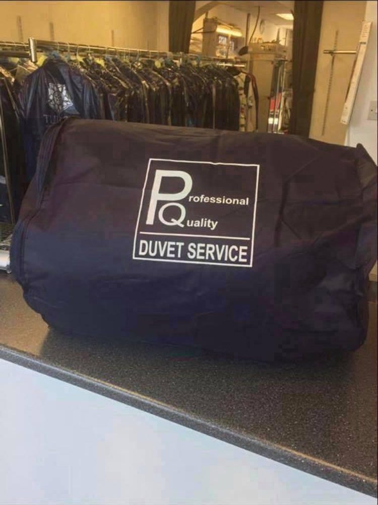 A laundered duvet returned in a Tudor Professional Quality breathable storage bag
